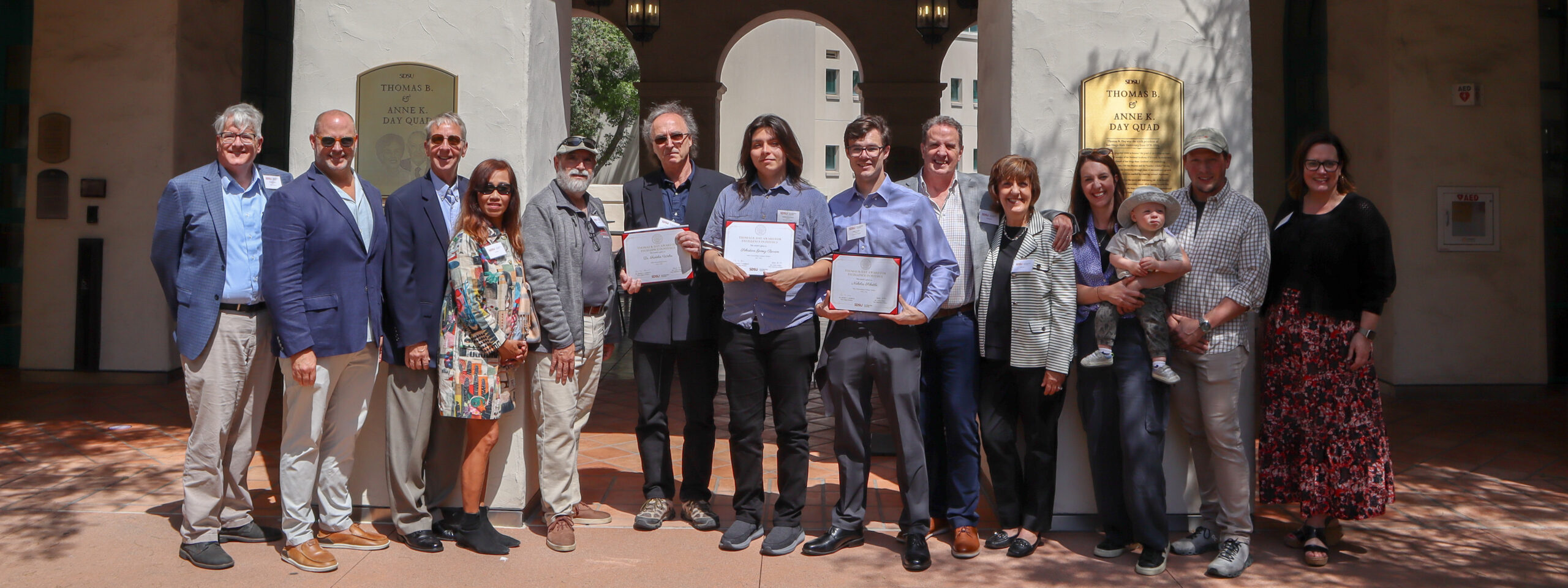 Dean Jeffrey Roberts, Adam Day, Brad Pitzer, Toy Pitzer, Sam Crivello, Professor Fridolin Weber, Sebastian Gomez-Barron, Nicholas Schottle, Tim Day, Krista Day, Meghan Day, Andrew Bollman and Vice Provost Sonjia Pruitt-Lord in Thomas B. & Anne K. Day Quad